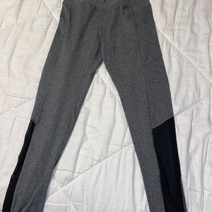 grey leggings with black mesh on lower legs